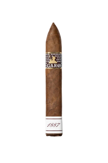 A single brown cigar shown vertically on a white background, featuring a patterned band with the brand name 'GARO' and a white lower section printed with '1887'.